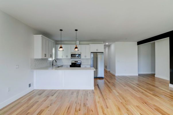 Interior, Kitchen, Pendant Lights, Recessed Lighting, Stainless Steel Appliances, Wood Texture Flooring