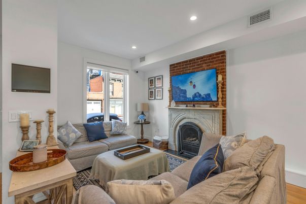Fireplace, Interior, Living room, Recessed Lighting, Stone Walls, Wood Texture Flooring
