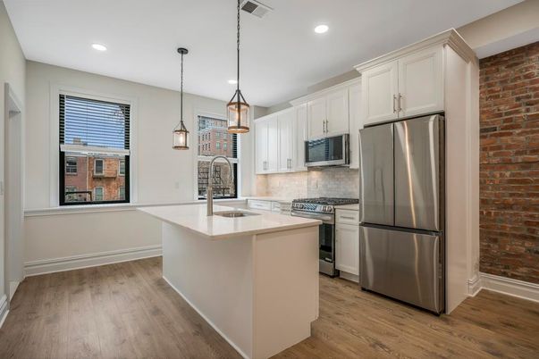 Interior, Kitchen, Pendant Lights, Recessed Lighting, Stainless Steel Appliances, Stone Walls, Wood Texture Flooring