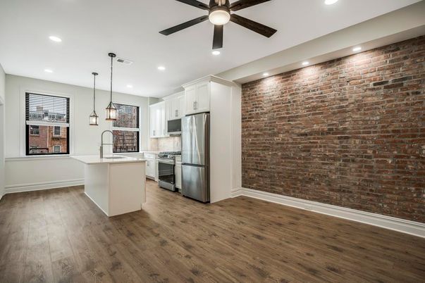 Interior, Kitchen, Pendant Lights, Recessed Lighting, Stainless Steel Appliances, Stone Walls, Wood Texture Flooring
