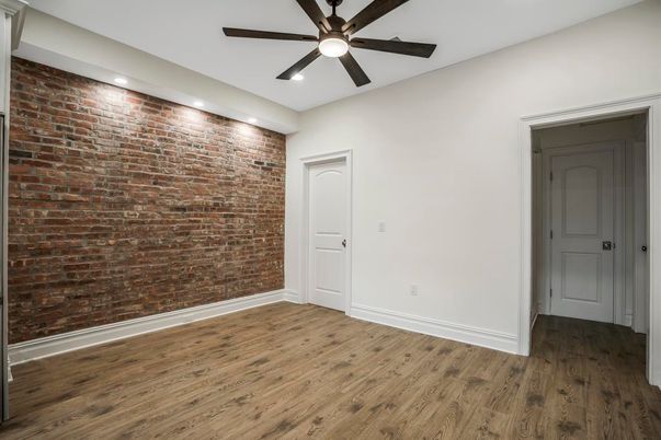 Empty room, Interior, Recessed Lighting, Stone Walls, Wood Texture Flooring