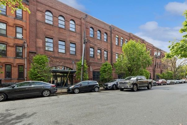 Exterior, Facade, Brick Facade, Condo Building