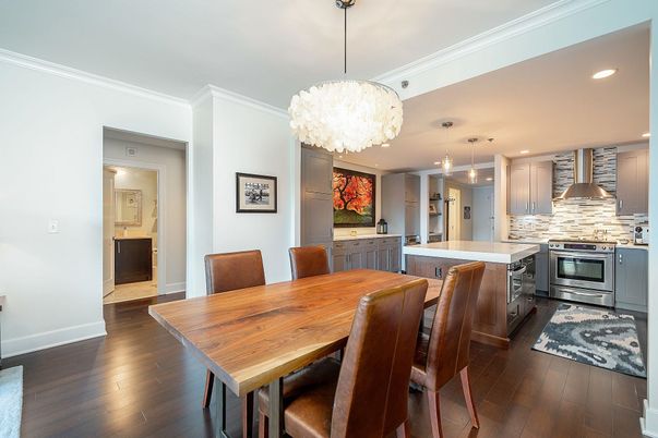 Chandelier, Dining room, Interior, Kitchen, Pendant Lights, Recessed Lighting, Stainless Steel Appliances, Wood Texture Flooring