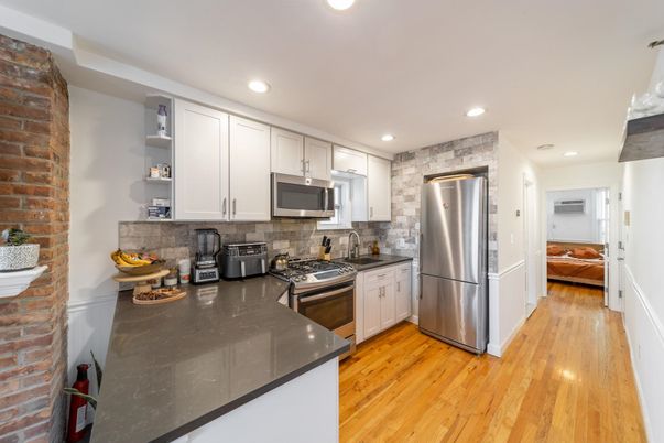 Interior, Kitchen, Recessed Lighting, Stainless Steel Appliances, Stone Walls, Wood Texture Flooring