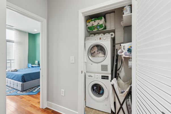Bedroom, Interior, Recessed Lighting, Utility Closets, Washer, Wood Texture Flooring