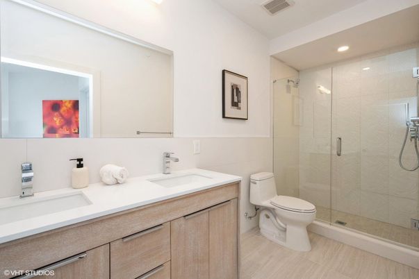 Bathroom, Dual Sink Vanities, Glass Shower, Interior, Recessed Lighting, Wood Texture Flooring