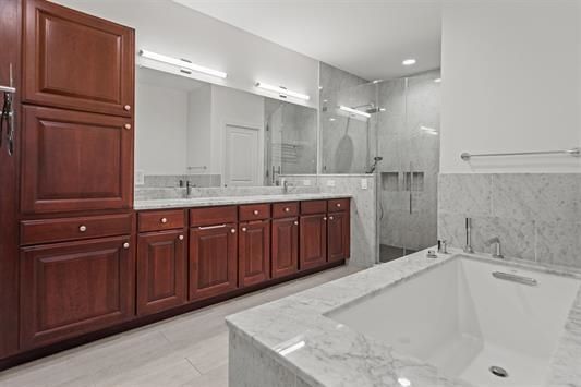 Bathroom, Dual Sink Vanities, Glass Shower, Interior, Marble Walls, Recessed Lighting