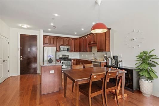 Dining room, Interior, Kitchen, Pendant Lights, Recessed Lighting, Stainless Steel Appliances, Wood Texture Flooring