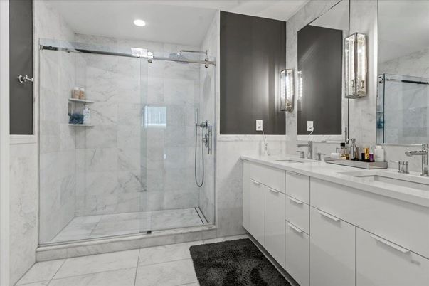 Bathroom, Dual Sink Vanities, Glass Shower, Interior, Marble Walls, Recessed Lighting