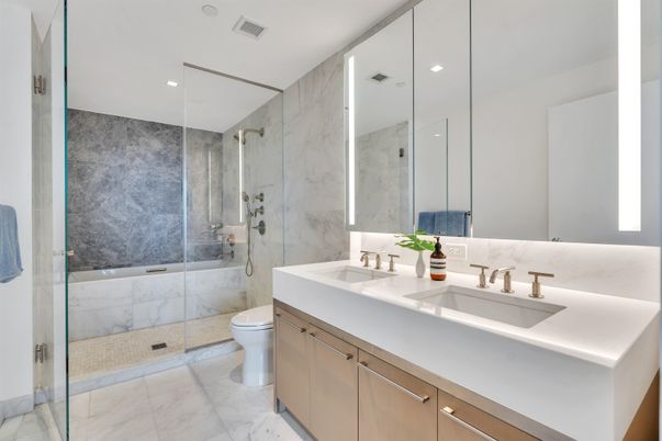 Bathroom, Dual Sink Vanities, Glass Shower, Interior, Marble, Marble Walls, Recessed Lighting