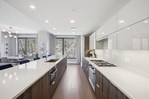 Dining room, Interior, Kitchen, Pendant Lights, Recessed Lighting, Stainless Steel Appliances, Wood Texture Flooring
