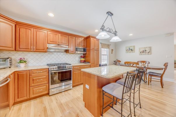 Dining room, Interior, Kitchen, Pendant Lights, Recessed Lighting, Stainless Steel Appliances, Wood Texture Flooring