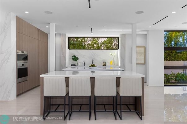 Interior, Kitchen, Marble Walls, Recessed Lighting, Stainless Steel Appliances