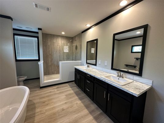 Bathroom, Dual Sink Vanities, Free Standing Baths, Interior, Recessed Lighting, Wood Texture Flooring