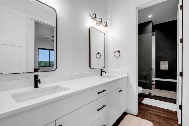 Bathroom, Dual Sink Vanities, Glass Shower, Interior, Recessed Lighting, Wood Texture Flooring