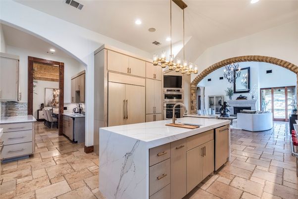 Chandelier, Fireplace, Interior, Kitchen, Living room, Pendant Lights, Recessed Lighting, Stainless Steel Appliances