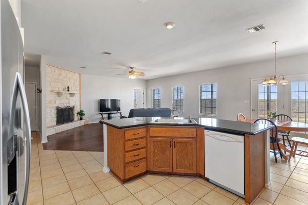 Dining room, Fireplace, Interior, Kitchen, Pendant Lights, Wood Texture Flooring