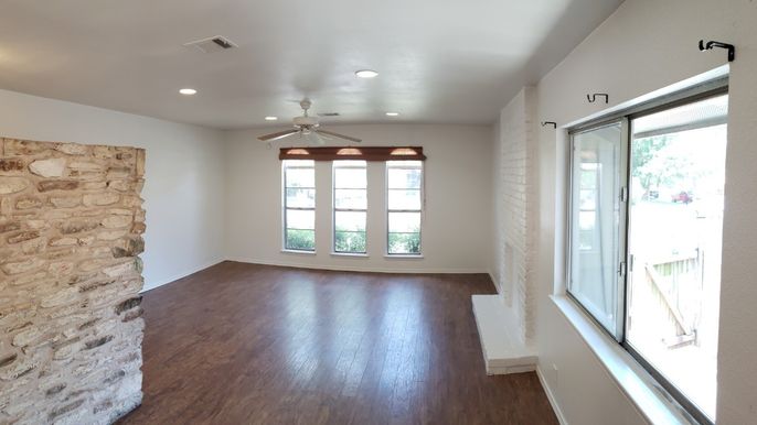 Empty room, Fireplace, Interior, Recessed Lighting, Stone Walls, Wood Texture Flooring
