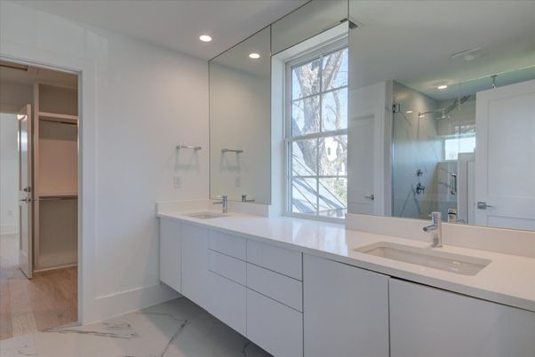 Bathroom, Dual Sink Vanities, Glass Shower, Interior, Marble, Recessed Lighting, Walk-in Closets, Wood Texture Flooring