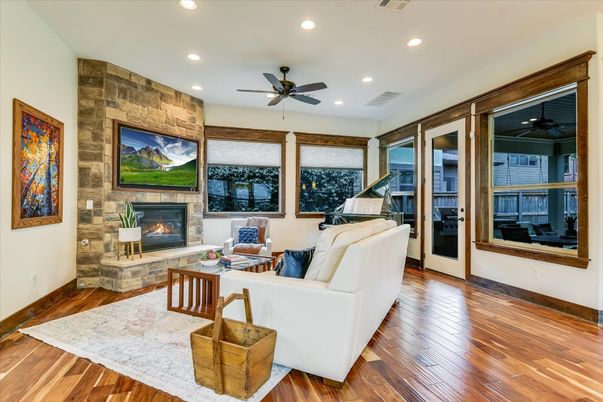 Fireplace, Interior, Living room, Recessed Lighting, Stone Walls, Wood Texture Flooring