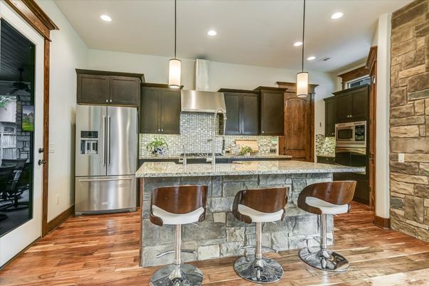 Interior, Kitchen, Pendant Lights, Recessed Lighting, Stainless Steel Appliances, Stone Walls, Wood Texture Flooring