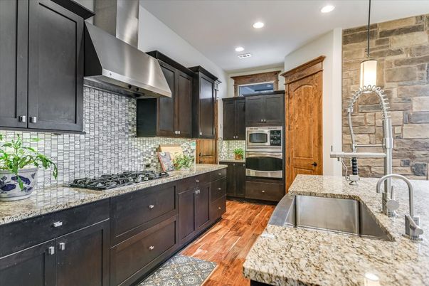 Interior, Kitchen, Pendant Lights, Recessed Lighting, Stainless Steel Appliances, Stone Walls, Wood Texture Flooring