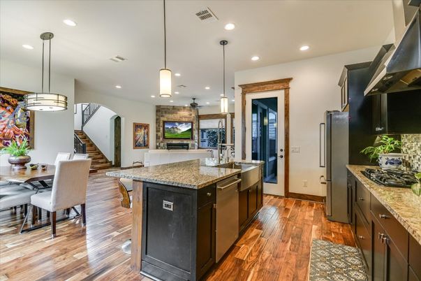 Dining room, Interior, Kitchen, Pendant Lights, Recessed Lighting, Stainless Steel Appliances, Wood Texture Flooring