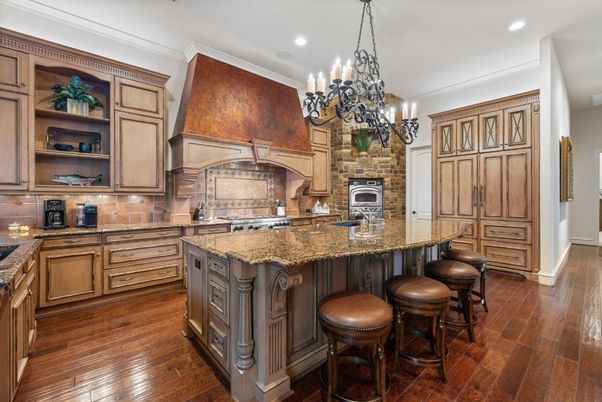 Chandelier, Fireplace, Interior, Kitchen, Recessed Lighting, Stainless Steel Appliances, Wood Texture Flooring
