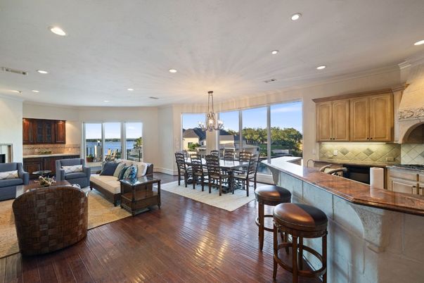 Chandelier, Dining room, Fireplace, Interior, Living room, Recessed Lighting, Water, Wood Texture Flooring