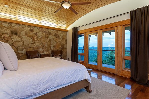 Bedroom, Fireplace, Interior, Stone Walls, Water, Wooden Ceilings, Wood Texture Flooring