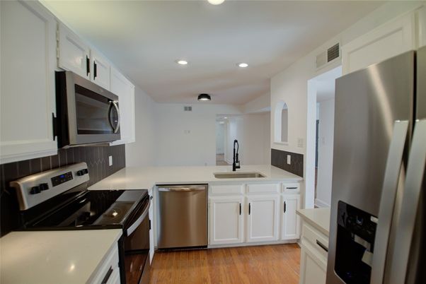 Interior, Kitchen, Recessed Lighting, Stainless Steel Appliances, Wood Texture Flooring