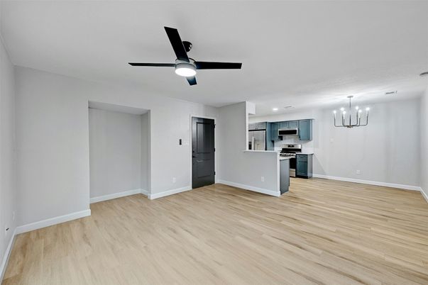 Chandelier, Empty room, Interior, Kitchen, Recessed Lighting, Stainless Steel Appliances, Wood Texture Flooring