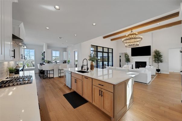 Chandelier, Dining room, Fireplace, Interior, Kitchen, Living room, Recessed Lighting, Stainless Steel Appliances, Wooden Beams, Wood Texture Flooring