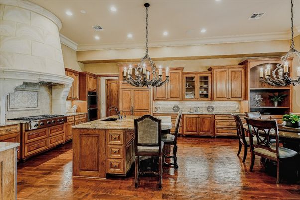 Chandelier, Dining room, Interior, Kitchen, Pendant Lights, Recessed Lighting, Stainless Steel Appliances, Wood Texture Flooring