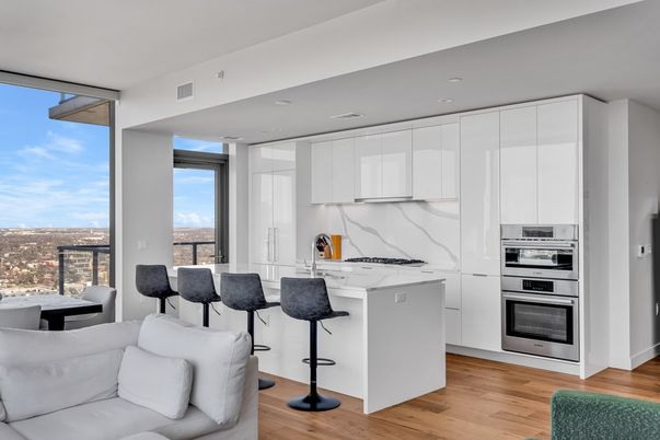 Interior, Kitchen, Marble Walls, Recessed Lighting, Stainless Steel Appliances, Wood Texture Flooring