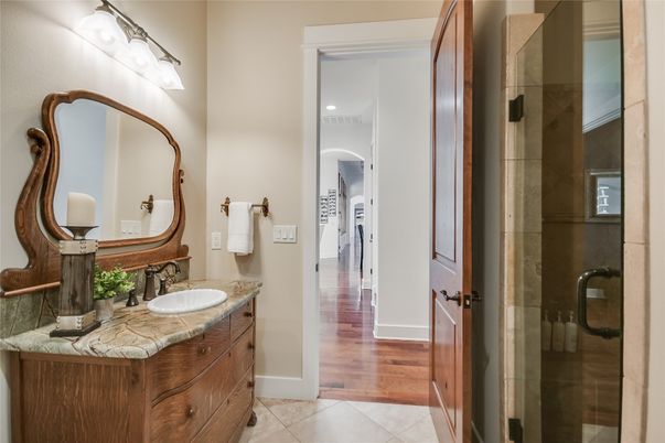 Bathroom, Dual Sink Vanities, Glass Shower, Interior, Recessed Lighting, Tile Countertops, Wood Texture Flooring