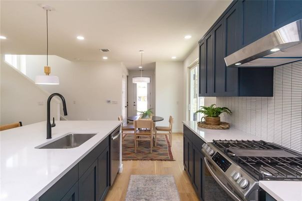 Dining room, Interior, Kitchen, Pendant Lights, Recessed Lighting, Stainless Steel Appliances, Wood Texture Flooring