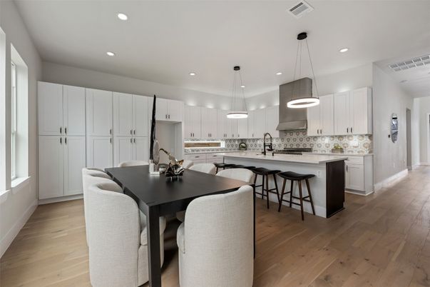 Dining room, Interior, Kitchen, Pendant Lights, Recessed Lighting, Stainless Steel Appliances, Wood Texture Flooring