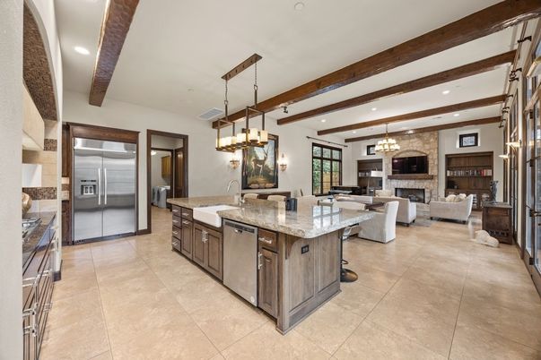 Chandelier, Dining room, Fireplace, Interior, Kitchen, Living room, Pendant Lights, Recessed Lighting, Stainless Steel Appliances, Wooden Beams