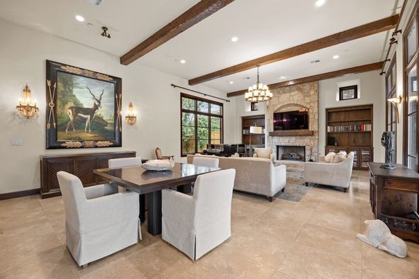 Chandelier, Dining room, Fireplace, Interior, Living room, Recessed Lighting, Stone Walls, Wooden Beams