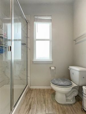 Bathroom, Glass Shower, Interior, Marble Walls, Wood Texture Flooring