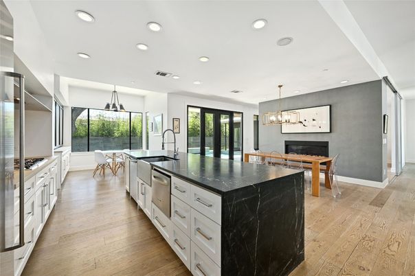 Chandelier, Dining room, Interior, Kitchen, Pendant Lights, Recessed Lighting, Stainless Steel Appliances, Wood Texture Flooring