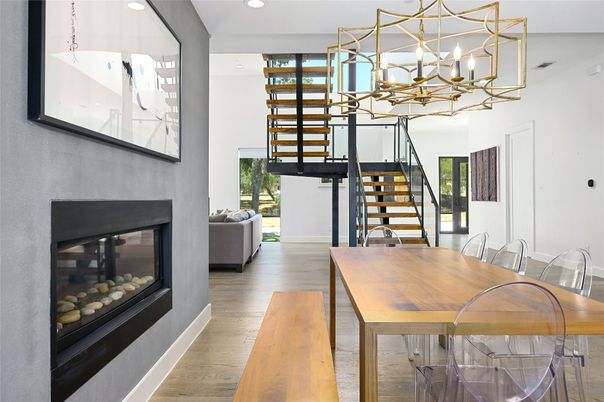 Dining room, Fireplace, Interior, Pendant Lights, Recessed Lighting, Wood Texture Flooring