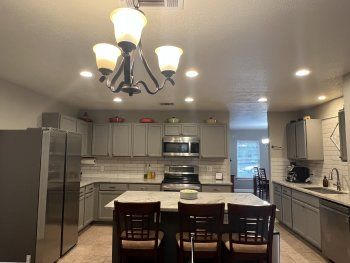 Chandelier, Interior, Kitchen, Recessed Lighting, Stainless Steel Appliances, Stone Walls