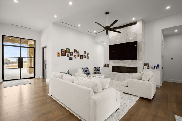 Fireplace, Interior, Living room, Marble Walls, Pendant Lights, Recessed Lighting, Wood Texture Flooring