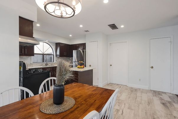 Dining room, Interior, Kitchen, Recessed Lighting, Stainless Steel Appliances, Wood Texture Flooring