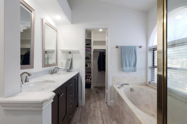 Bathroom, Dual Sink Vanities, Interior, Recessed Lighting, Walk-in Closets, Wood Texture Flooring
