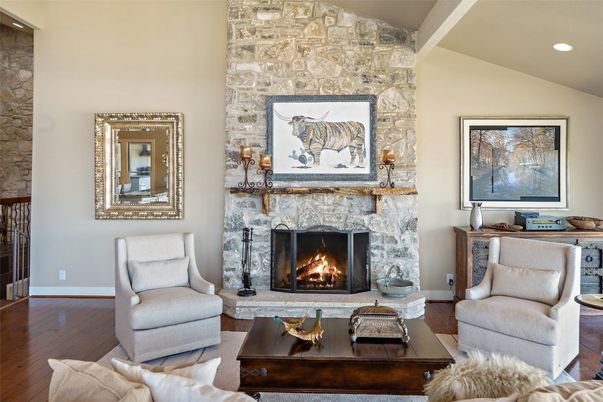 Fireplace, Interior, Living room, Recessed Lighting, Stone Walls, Wood Texture Flooring
