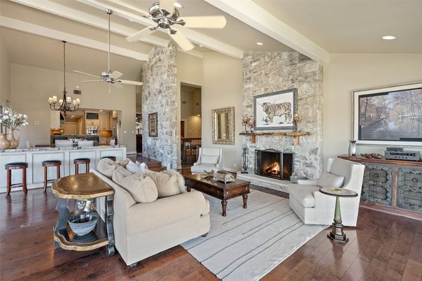 Chandelier, Fireplace, Interior, Kitchen, Living room, Pendant Lights, Recessed Lighting, Stone Walls, Wood Texture Flooring