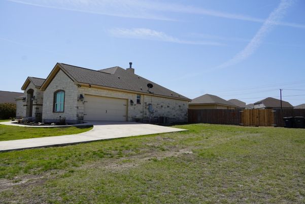 Attached, Backyard, Exterior, Facade, Brick Facade, Ranch